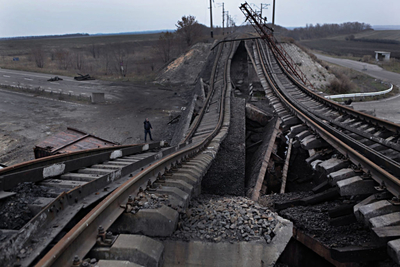 On the Ukrainian held territory the railway bridge, blown up by the separatists, blocking the highway from Donetsk to Slovyansk. 60 % of the railways and the roads nfrastructure have been destroyed in Donbass, as a result of civil war. Krasny Partizansk, Eastern Ukraine, November 11 2014. Photographer: Dmitry Beliakov/ for Der Spiegel