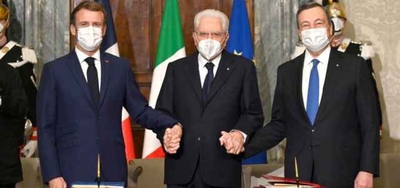 From left to right, France's President Emmanuel Macron, Italy's President Sergio Mattarella and Italy's Prime Minister Mario Draghi pose for a photograph during the signing of the Franco-Italian Quirinal Treaty at the Quirinale presidential palace in Rome, Friday, Nov. 26, 2021. (Alberto Pizzoli / Pool photo via AP)